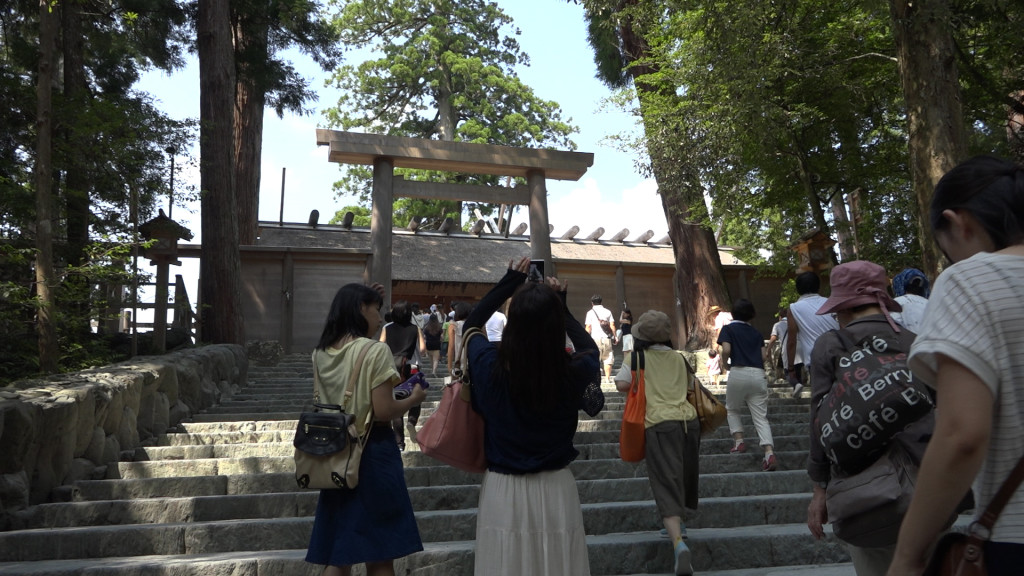 You can see people taking photos from outside the Torii gates. Once past the gates no cameras are allowed. 